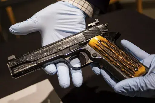 This photo taken Monday, Dec. 23, 2024, in Las Vegas shows a Colt .45-caliber pistol that once belonged to mob boss Al Capone. It is going on display for the first time at the Mob Museum in Las Vegas, starting Jan. 15, 2025. (AP Photo/Ty ONeil)