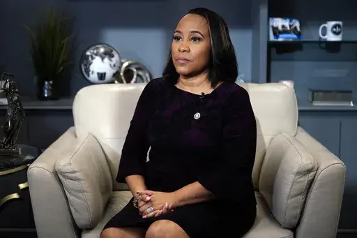 District Attorney for Fulton County, Fani Willis speaks during an interview with The Associated Press on Dec. 12, 2023, in Atlanta. Accusations that Willis had an inappropriate relationship with a special prosecutor she hired to seek convictions of Donald Trump and others for interfering in Georgia's 2020 election have led to renewed calls to remove Willis from the case.(AP Photo/Brynn Anderson)
