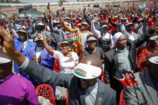 Kenyans attend a national day of prayer event held at Nyayo stadium in the capital Nairobi, Kenya, Tuesday, Feb. 14, 2023. With the prospect of a sixth consecutive failed rainy season in the east and Horn of Africa, Kenya's president is hoping the heavens will finally open with the help of a national day of mass prayer. (AP Photo/Brian Inganga)