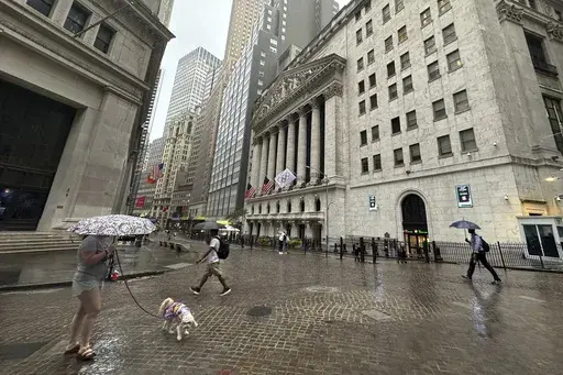 People walk past the New York Stock Exchange on Aug. 7, 2024 in New York. (AP Photo/Peter Morgan, File)