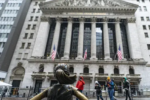 The Fearless Girl statue stands outside of the New York Stock Exchange is shown on Friday, Jan. 19, 2024, in New York. Wall Street is rising Friday and may break past its all-time high set two years ago, before the highest inflation and interest rates in decades sent financial markets tanking worldwide. (AP Photo/Peter K. Afriyie)