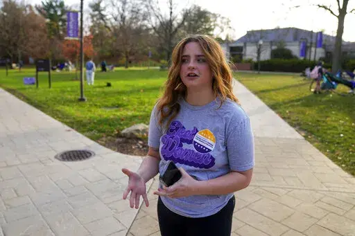 Brianna McCullough, 20, a sophomore at Chatham University in Pittsburgh, walks through campus on Thursday, Nov. 10, 2022. Support for abortion rights did drive women to the polls in Tuesday's elections. But for many, the issue took on higher meaning, part of an overarching concern about the future of democracy. "If they can take this away, they can take anything away from people. And I don't think that's right." McCullough said.(AP Photo/Gene J. Puskar)