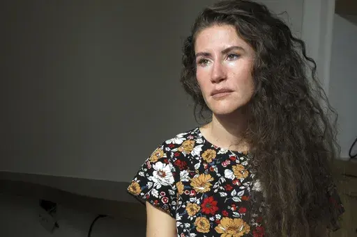 Chelsea Goodrich poses for a portrait at a friend's house in Ketchum, Idaho, on Tuesday, Sept. 19, 2023. Goodrich's father, a popular Idaho dentist and former bishop in The Church of Jesus Christ of Latter-day Saints, widely known as the Mormon church, was excommunicated after sharing details about his relationship with her when she was a child during a religious confession. Recordings obtained by The Associated Press show that instead of helping prosecutors, the church used a legal playbook tha