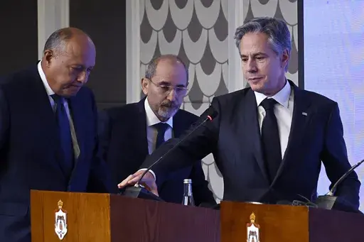 U.S. Secretary of State Antony Blinken, right, Egyptian Foreign Minister Sameh Shoukry, left, and Jordanian Deputy Prime Minister and Foreign Minister Ayman Safadi attend a press conference in Amman, Jordan, Saturday, Nov. 4, 2023. Blinken is making a new push to ease the plight of civilians. He met with Arab foreign ministers on Saturday in Jordan, the day after talks in Israel with Prime Minister Benjamin Netanyahu, who insisted there could be no temporary cease-fire until all hostages held by
