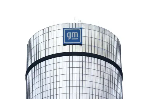 A General Motors logo is seen on a building, April 24, 2024, in Detroit. GM will pay nearly $146 million in penalties to the federal government because 5.9 million of its older vehicles don’t comply with emissions and fuel economy standards. (AP Photo/Paul Sancya, File)