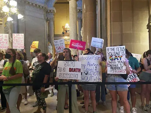 Abortion-rights protesters fill Indiana Statehouse corridors and cheer outside legislative chambers, Friday, Aug. 5, 2022, as lawmakers vote to concur on a near-total abortion ban, in Indianapolis. An Indiana judge on Thursday, Sept. 22, blocked the state’s abortion ban from being enforced, putting the law on hold as abortion clinic operators argue that the new law violates the state constitution.(AP Photo/Arleigh Rodgers, File)