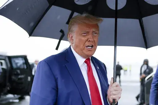 Former President Donald Trump speaks before he boards his plane at Ronald Reagan Washington National Airport, Aug. 3, 2023, in Arlington, Va. Special counsel Jack Smith’s team obtained a search warrant in January for records related to former President Donald Trump’s Twitter account, and a judge levied a $350,000 fine on the company for missing the deadline to company. That’s according to court documents released Wednesday. (AP Photo/Alex Brandon, File)