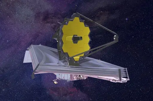 This 2015 artist's rendering provided by Northrop Grumman via NASA shows the James Webb Space Telescope. On Monday, Jan. 24, 2022, the world’s biggest and most powerful space telescope reached its final destination 1 million miles away, one month after launching on a quest to behold the dawn of the universe. (Northrop Grumman/NASA via AP)
