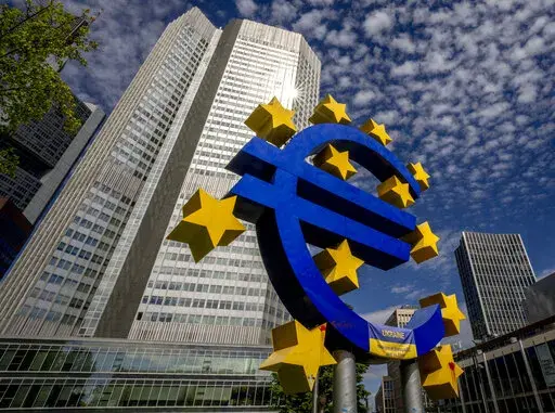 The Euro sculpture stands in front of the former European Central Bank in Frankfurt, Germany, on July 13, 2022. The euro has fallen below parity with the dollar, diving to its lowest level in 20 years and ending a one-to-one exchange rate with the U.S. currency. .(AP Photo/Michael Probst)