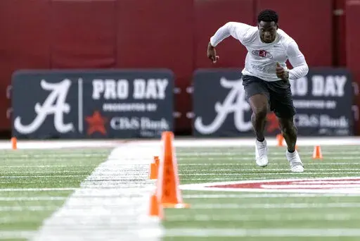 Former Alabama football player Brian Robinson Jr. participates in shuttle drills at Alabama's NFL Pro Day, Wednesday, March 30, 2022, in Tuscaloosa, Ala. (AP Photo/Vasha Hunt)