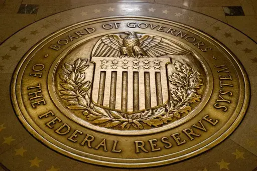 FILE- The seal of the Board of Governors of the United States Federal Reserve System is displayed in the ground at the Marriner S. Eccles Federal Reserve Board Building in Washington, Feb. 5, 2018. Facing the prospect of a third financial crisis in less than two decades, the Federal Reserve initiated a broad emergency lending program late Sunday, March 12, 2023, intended to shore up confidence in the nation's financial system following the collapse of two large banks with deep ties to the tech i