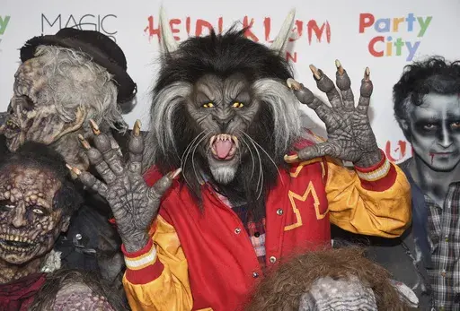 Heidi Klum, dressed as a werewolf from Michael Jackson's "Thriller" video, attends her 18th Annual Halloween Party at Moxy Times Square on Tuesday, Oct. 31, 2017, in New York. (Photo by Evan Agostini/Invision/AP, File)