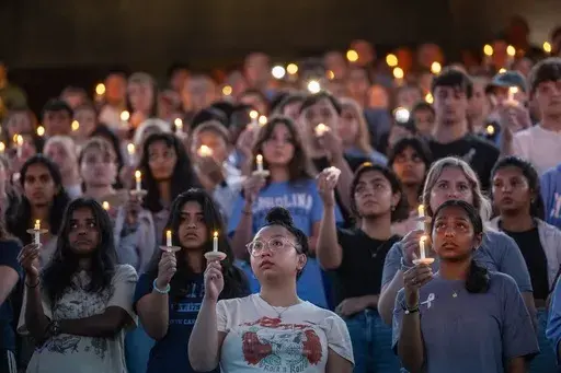 University of North Carolina-Chapel Hill students, faculty and family hold a candlelight vigil, Aug 30, 2023, in Chapel Hill, N.C., in honor of professor Zijie Yan, who was shot and killed on campus earlier that week. Two shooting 30 years apart at the University of North Carolina show how much has changed. Some alumni who remember a deadly shooting in 1995 now have children enrolled at their alma mater in Chapel Hill, where an associate professor was shot to death Aug. 28. In some ways, the era
