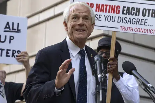 Former White House trade adviser Peter Navarro speaks to the media as he departs federal court, Tuesday, Sept. 5, 2023, in Washington. Navarro was convicted Thursday, Sept. 7, of contempt of Congress charges filed after he was accused of refusing to cooperate with a congressional investigation into the Jan. 6, 2021, attack on the U.S. Capitol. (AP Photo/Mark Schiefelbein, File)