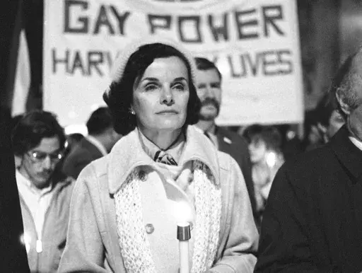 San Francisco Mayor Dianne Feinstein carries a candle as she leads an estimated 15,000 marchers also carrying candles during a march in memory of slain Mayor George Moscone and Supervisor Harvey Milk in San Francisco, Nov. 28, 1979. After Feinstein, the nation’s oldest sitting U.S. senator, died at age 90, LGBTQ+ leaders are lauding her as a longtime friend dating to a time when not many could be found. (AP Photo/Paul Sakuma, File)