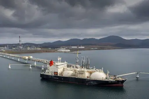 The tanker Sun Arrows loads its cargo of liquefied natural gas from the Sakhalin-2 project in the port of Prigorodnoye, Russia, on Oct. 29, 2021. The United States unleashed some of its toughest actions against Russian President Vladimir Putin right after he rolled his troops into Ukraine. Polls show people want the U.S. to do more. (AP Photo/File)