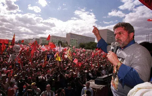 Honorary president of the Workers Party, Luiz Inacio Lula da Silva, speaks during a protest against the free-market reforms of President Fernando Henrique Cardoso, in Brasilia, Brazil, Aug. 26, 1999. (AP Photo/Beto Barata, File)