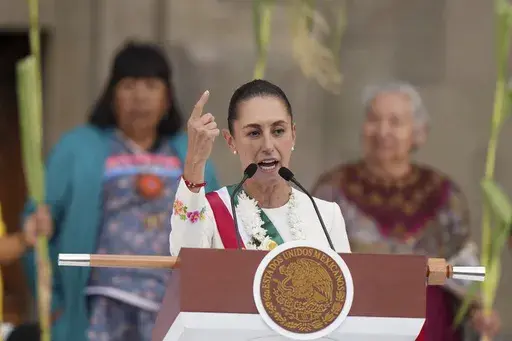 Newly-sworn in President Claudia Sheinbaum addresses supporters in the Zócalo, Mexico City's main square, on Oct. 1, 2024. (AP Photo/Fernando Llano, File)