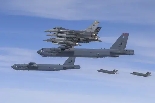 In this photo provided by the South Korean Defense Ministry, U.S. B-52H bombers, center, and F-16 fighter jets and South Korean Air Force F-35A fighter jets, right bottom, fly over the Korean Peninsula during a joint air drill in South Korea on April 14, 2023. The United States flew nuclear-capable bombers to the Korean Peninsula on Friday, June 30, in its latest show of force against North Korea, days after the North staged massive anti-U.S. rallies in its capital. (South Korea Defense Ministry