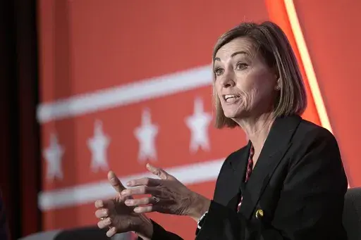 Iowa Gov. Kim Reynolds takes part in a panel discussion during a Republican Governors Association conference on Nov. 15, 2022, in Orlando, Fla. On Monday, July 17, 2023, an Iowa judge temporarily blocked the state’s new ban on most abortions after about six weeks of pregnancy, just days after Reynolds signed the measure into law. (AP Photo/Phelan M. Ebenhack, File)