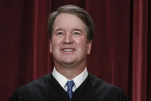Supreme Court Justice Brett Kavanaugh poses for a new group portrait at the Supreme Court building in Washington, Oct. 7, 2022. Kavanaugh sought Thursday, July 13, 2023, to dispel notions of a partisan high court, stressing the collegial relationships among the justices that sometimes help them land on the same sides of issues despite their differences. Kavanaugh sought Thursday to dispel notions of a partisan high court, stressing the collegial relationships among the justices that sometimes he