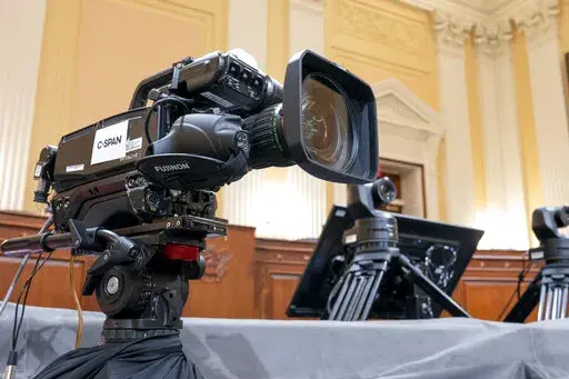 Television crews and technicians prepare the Cannon Caucus Room for Thursday night's hearing by the House select committee investigating the attack of Jan. 6, 2021, at the Capitol in Washington, June 7, 2022. (AP Photo/J. Scott Applewhite, File)