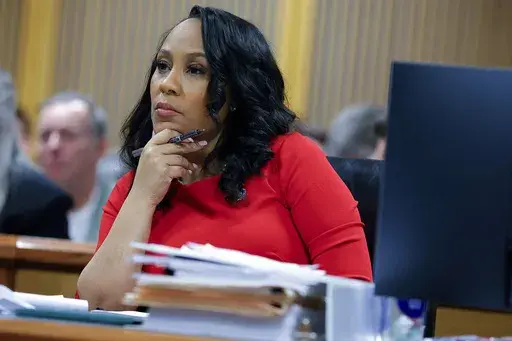Fulton County District Attorney Fani Willis looks on during a hearing on the Georgia election interference case, Friday, March, 1, 2024, in Atlanta. An attorney for Donald Trump says he’s optimistic an appellate review will lead to the Georgia 2020 election interference case against him being dismissed and Fulton County District Attorney Fani Willis being disqualified. (AP Photo/Alex Slitz, Pool, File)