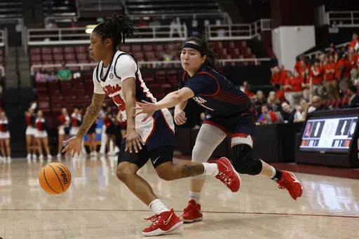 Mississippi guard Angel Baker (15) drives to the basket against Gonzaga guard Kaylynne Truong, right, in the first half of a first-round college basketball game in the women's NCAA Tournament in Stanford, Calif., Friday, March 17, 2023. (AP Photo/Josie Lepe)