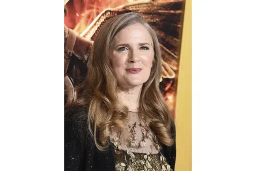 Suzanne Collins arrives at the Los Angeles premiere of "The Hunger Games: Mockingjay - Part 1" at the Nokia Theatre L.A. Live on Nov. 17, 2014. Collins is returning to the ravaged, post-apocalyptic land of Panem for a new “The Hunger Games” novel. Scholastic announced Thursday that “Sunrise on the Reaping” will be published March 18, 2025. (Photo by Jordan Strauss/Invision/AP, File)