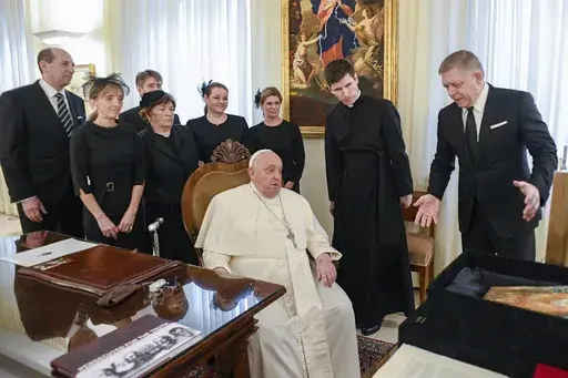 Pope Francis meets with Czech Republic's Prime Minister Robert Fico, right, and his entourage at The Vatican Friday, Feb. 14, 2025. (Vatican Media via AP, HO)