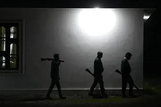Village Defense Group members patrol during night at Muradpur village in Rajouri, India, Feb. 8, 2023. Days after seven Hindus were killed in the village in disputed Kashmir, hundreds of residents staged protests across the region's Hindu-dominated areas. In response, Indian authorities revived a government-sponsored militia and began rearming and training villagers. The militia, officially called the “Village Defense Group,” was initially formed in the 1990s as the first line of defense aga
