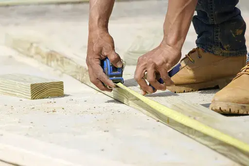 A beam is measured and marked at a housing site in Madison County, Miss., Tuesday, March 16, 2021. Homeowners may be reconsidering their remodeling plans this year because of the economy’s recent turbulence, but planning and prioritizing can help you accomplish projects with confidence. (AP Photo/Rogelio V. Solis, File)
