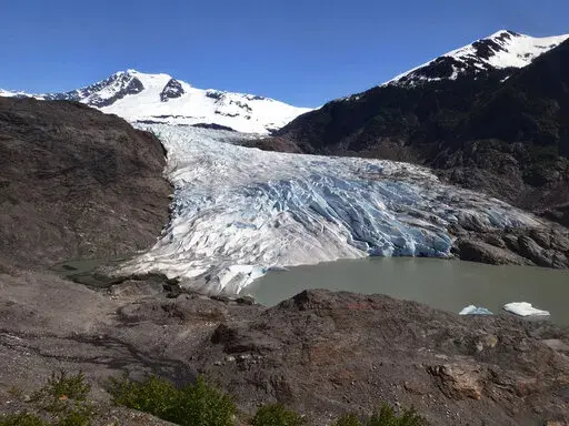 Chunks of ice float on Mendenhall Lake in front of the Mendenhall Glacier on Monday, May 30, 2022, in Juneau, Alaska. A study of all of the world's 215,000 glaciers published on Thursday, Jan. 5, 2023, finds even if with the unlikely minimum warming of only a few tenths of a degrees more, the world will lose nearly half its glaciers by the end of the century. With the warming we're now on track to get, the world will lose two-thirds of its glaciers and overall glacier mass will drop by one-third