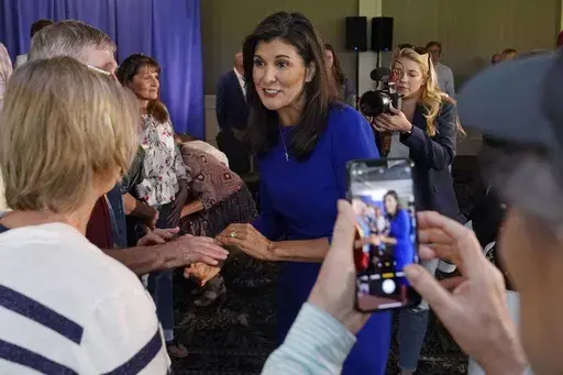 Republican presidential candidate Nikki Haley greets guests during a campaign gathering, Wednesday, May 24, 2023, in Bedford, N.H. More than a dozen candidates are seeking the nomination, including several long shots who announced their bids in recent weeks, in what is the party's most diverse presidential field ever. Yet Nikki Haley, a former U.N. ambassador and South Carolina governor, is the only woman among the bunch. (AP Photo/Charles Krupa, File)