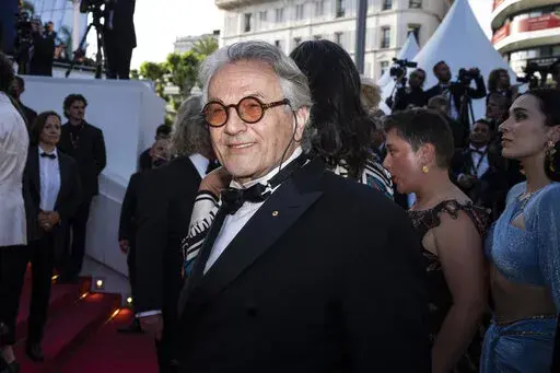 Director George Miller poses for photographers upon arrival at the premiere of the film 'Three Thousand Years of Longing' at the 75th international film festival, Cannes, southern France, Friday, May 20, 2022. (AP Photo/Petros Giannakouris)