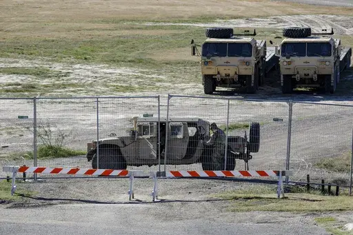 A Texas Department of Public Safety officer guards an entrance to Shelby Park, Thursday, Jan. 11, 2024, in Eagle Pass, Texas. The Justice Department on Friday, Jan. 12, asked the Supreme Court to order Texas to stop blocking Border Patrol agents from a portion of the U.S.-Mexico border where large numbers of migrants have crossed in recent months, setting up another showdown between Republican Gov. Greg Abbott and the Biden administration over immigration enforcement. (Sam Owens /The San Antonio