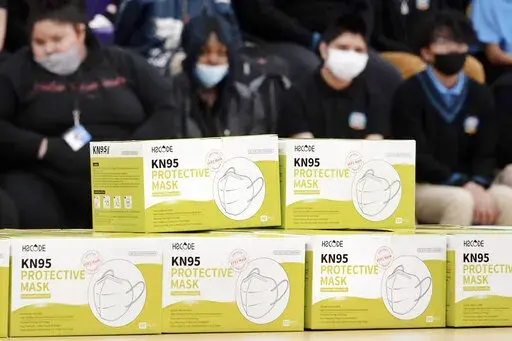 Boxes of KN95 protective masks are stacked together before being distributed to students at Camden High School in Camden, N.J., Wednesday, Feb. 9, 2022. According to a study by the Centers for Disease Control and Prevention released Tuesday, April 26, 2022,  three out of every four U.S. children have been infected with COVID-19. (AP Photo/Matt Rourke, File)