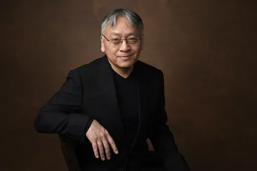 Kazuo Ishiguro poses for a portrait at the 95th Academy Awards Nominees Luncheon in Beverly Hills, Calif., on Feb. 13, 2023. Publisher Alfred A. Knopf announced Thursday that Ishiguro's “The Summer We Crossed Europe in the Rain,” a collection of lyrics written for the million-selling jazz singer Stacey Kent, will be released on March 5. (AP Photo/Chris Pizzello, File)