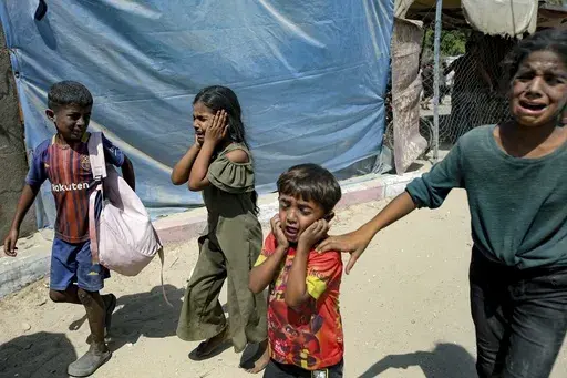 Palestinian children are evacuated from a site hit by an Israeli bombardment on Khan Younis, southern Gaza Strip, Saturday, July 13, 2024. (AP Photo/Jehad Alshrafi, File)