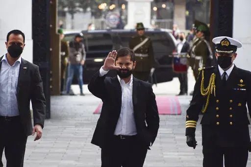 Chilean President Gabriel Boric arrives to his office at La Moneda presidential palace in Santiago, Chile, Monday, Sept. 5, 2022. Chileans overwhelmingly rejected a progressive new constitution to replace its dictatorship-era charter, dealing a blow to Boric, who made clear the process to amend it would not end with Sunday's vote. (AP Photo/Matias Basualdo)