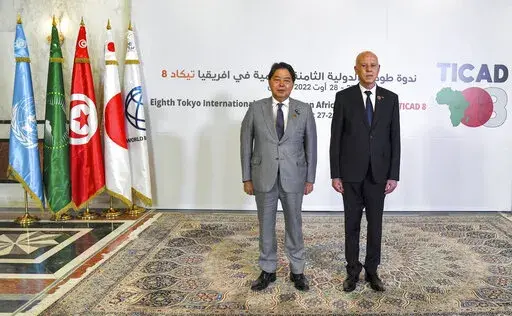 Tunisia's President Kais Saied, right, and Japan's Foreign Minister Yoshimasa Hayashi pose for a photo during the eighth Tokyo International Conference on African Development (TICAD) in Tunisia's capital Tunis on Saturday, Aug. 27, 2022. African heads of state, representatives of international organizations and private business leaders are in Tunisia this weekend for the eighth iteration of the Tokyo International Conference on African Development, a triennial event launched by Japan to promote 