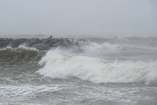 Waves crash at Outlook Beach in Hampton, Va., Sept. 30, 2022. Storms with strong gusting winds sometimes cause a phenomenon known as a meteotsunami, in which the winds push on the water and increase the wave height near the coast before it eventually crashes onto shore. (Billy Schuerman/The Virginian-Pilot via AP, File)