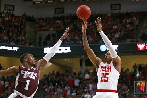 'Texas Tech's Adonis Arms (25) shoots over Mississippi State's Iverson Molinar (1) during the first half of an NCAA college basketball game on Saturday, Jan. 29, 2022, in Lubbock, Texas. (AP Photo/Brad Tollefson)