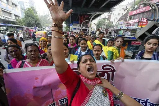 An activist shouts slogan as she leads a rally to mark the International Day for the Elimination of Violence against Women, in Kolkata, India, Monday, Nov. 25, 2024. (AP Photo/Bikas Das)