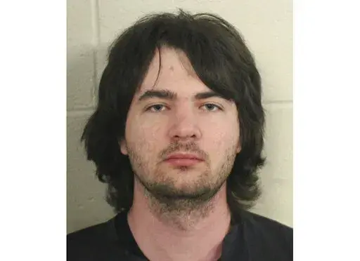 This photo provided by Floyd County, Ga., Police shows Robert Keith Tincher III.  Police say Tincher killed his grandmother by stuffing her in a freezer while she was still alive. Floyd County Police discovered the body of Doris Cumming, 82, late Thursday, April 14, 2022,  in the Armuchee home she shared with her grandson, 29-year-old Robert Keith Tincher III.(Floyd County, GA., Police via AP)