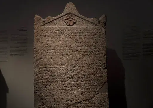 The Heliodorus Stele, loaned by American billionaire Michael Steinhardt, is displayed at the Israel Museum in Jerusalem, Wednesday, Jan. 5, 2022. Last month, Steinhardt surrendered the artifact, along with 179 others valued at roughly $70 million, as part of a landmark deal with the Manhattan District Attorney's office to avoid prosecution. Eight Neolithic masks loaned by Steinhardt to the Israel Museum for a major exhibition in 2014 were also seized as part of the billionaire's deal with New Yo