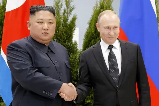 Russian President Vladimir Putin, right, and North Korea's leader Kim Jong Un shake hands during their meeting in Vladivostok, Russia, Thursday, April 25, 2019. A North Korean train presumably carrying North Korean leader Jong Un has departed for Russia for a possible meeting with Russian President Putin, South Korean media said Monday, Sept. 11, 2023. Citing unidentified South Korean government sources, the Chosun Ilbo newspaper reported that the train likely left the North Korean capital of Py