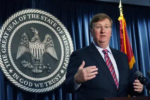 Mississippi Gov. Tate Reeves announces the state-imposed boil-water notice has been lifted in Mississippi's capital city after nearly seven weeks, during a Thursday, Sept. 15, 2022, news conference in Jackson, Miss. Emergency repairs are still underway after problems at Jackson's main water treatment plant caused most customers to lose service for several days in late August and early September. (AP Photo/Rogelio V. Solis)
