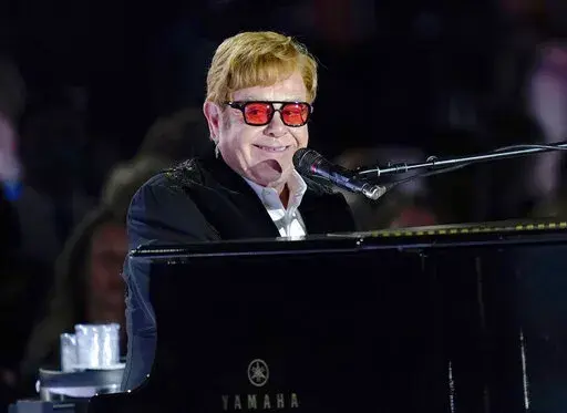 Elton John performs on the South Lawn of the White House in Washington, Friday, Sept. 23, 2022. Elton John is scheduled to perform at the Glastonbury Festival in June, in what organizers say will be his last-ever show in Britain. The festival announced Friday, Dec. 2, 2022 that the star will play the 2023 festival’s final night on June 25 (AP Photo/Susan Walsh, File)