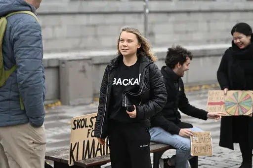 Climate activist Greta Thunberg arrives at the weekly Fridays for Future demonstration at the Mynttorget square next to the Swedish Parliament Riksdagen, in Stockholm, Sweden, on Nov. 11, 2022. Thunberg said Friday June 9, 2023 she will no longer be able to skip classes as a way to draw attention to climate change because she is graduating from high school. (Pontus Lundahl/TT News Agency via AP, File)